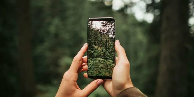 Smartphone with charger and power bank prepared for hiking safety