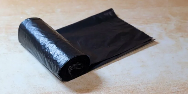 Tent carpet soaked and cleaned inside sealed garbage bag with water and detergent