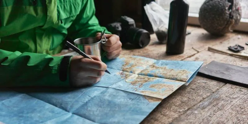 Hiker checking weather forecast before planning a hiking trip in nature